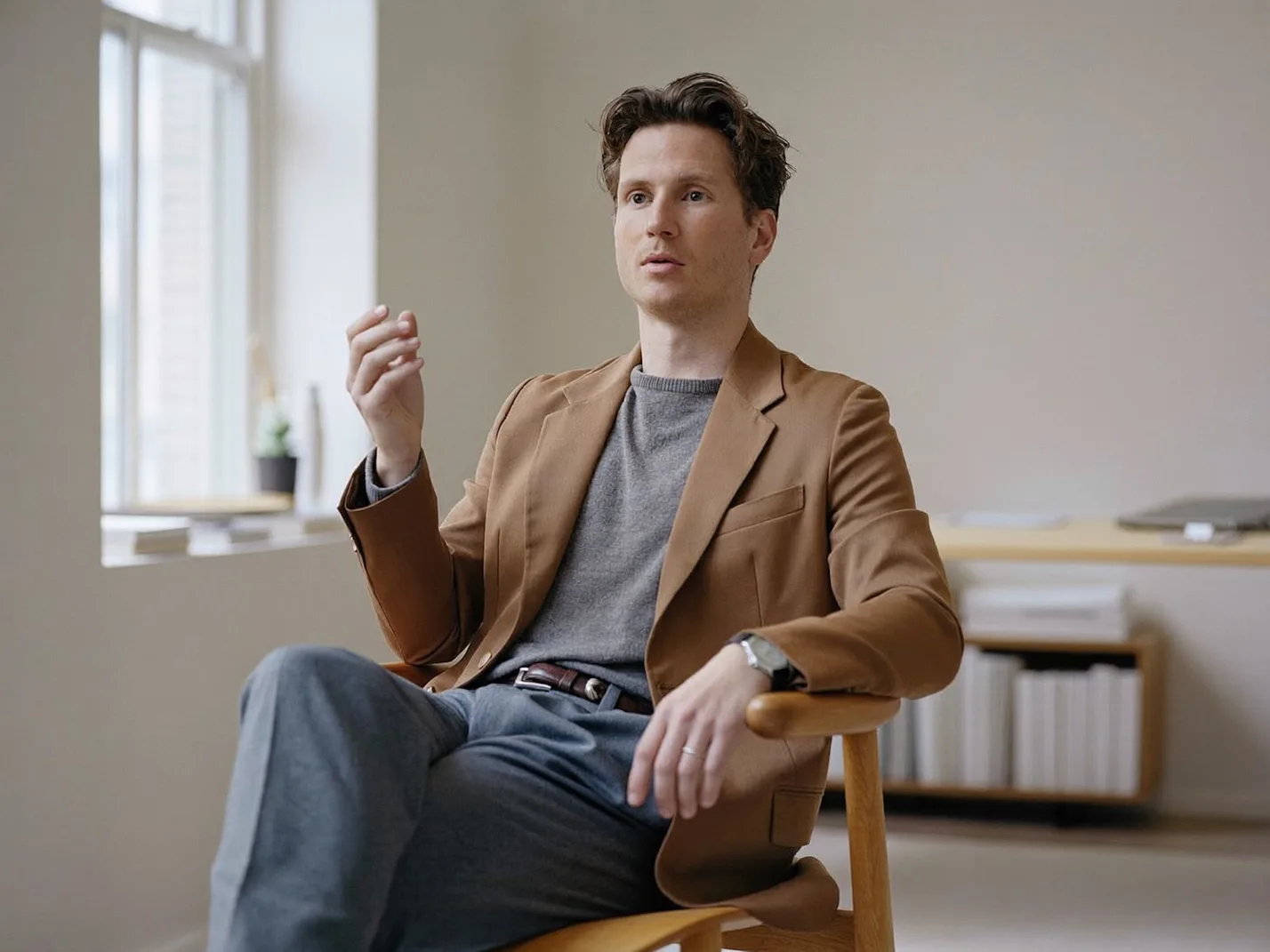 Still from the Maglut film: a founder seated in the Long Beach office